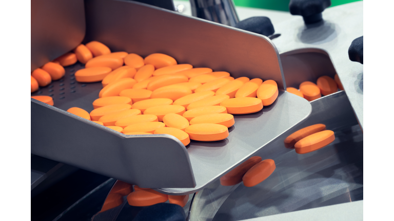 Pharmaceutical production line, production of tablets or vitamins manufacturing, tablet conveyor