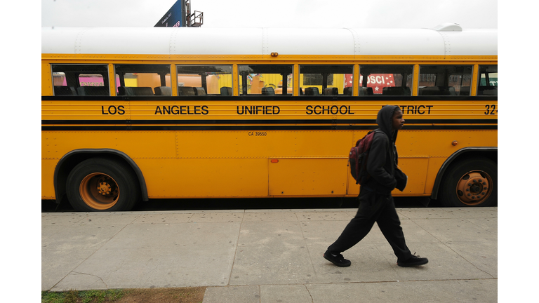 A student on his way to school walks pas