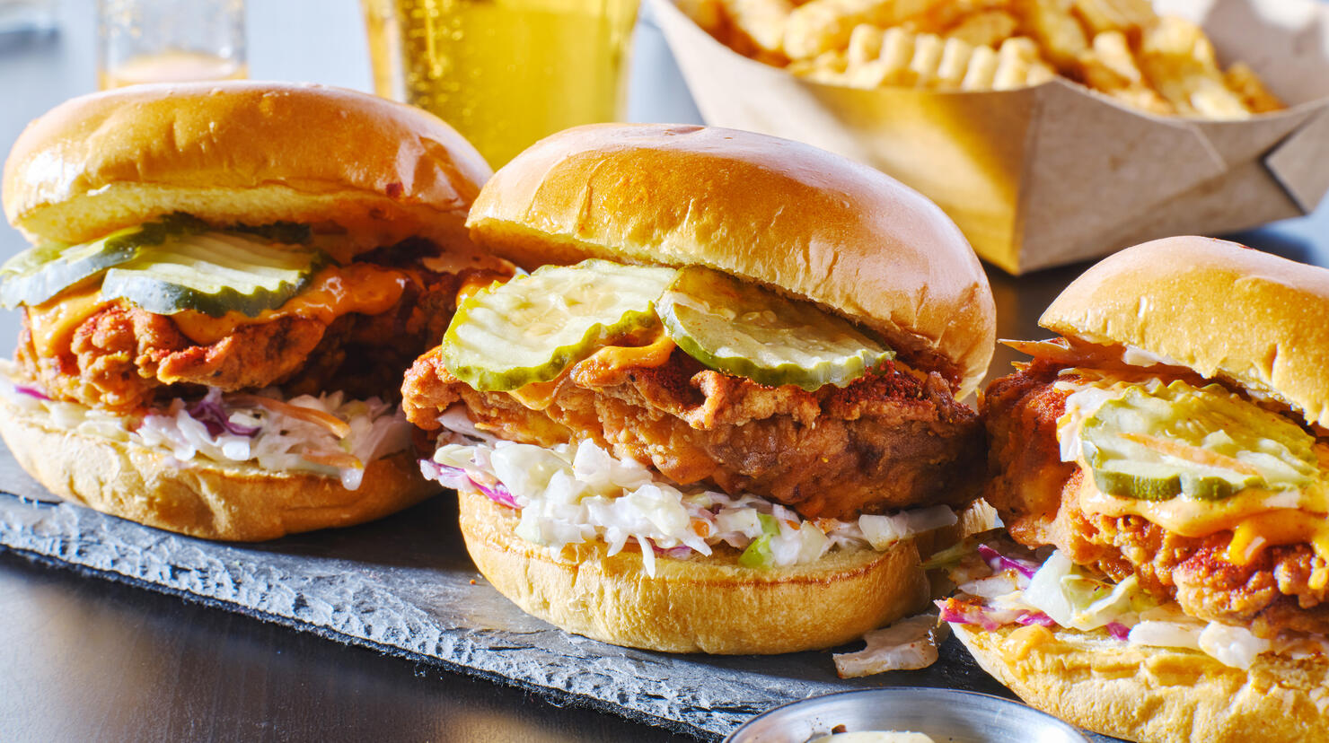 spicy nashville hot chicken sandwich with coleslaw and pickles