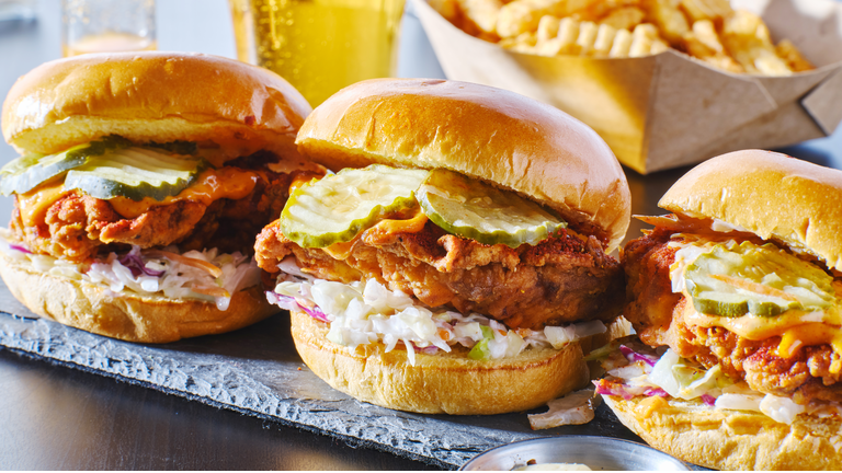 spicy nashville hot chicken sandwich with coleslaw and pickles