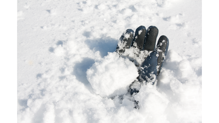 Glove buried in snow