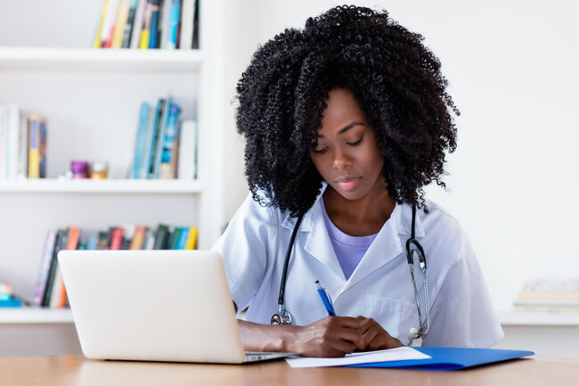 Working african american nurse or medical student