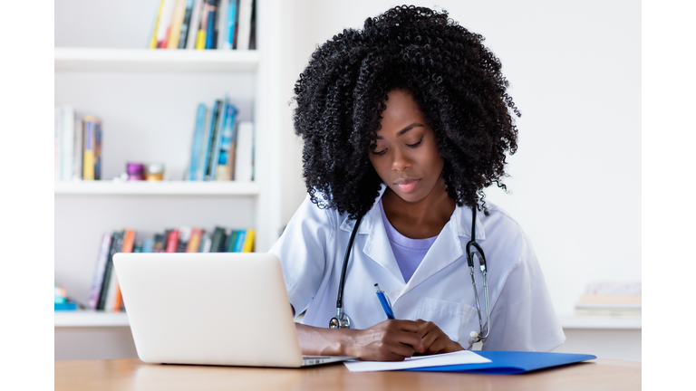 Working african american nurse or medical student