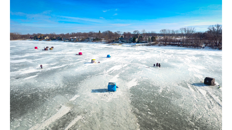 Ice fishing on a warm winter day