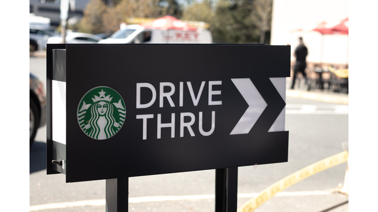 Cars lining up to order food using drive-thru facilitiy at local Starbucks Coffee Shop