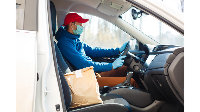 food delivery man Wearing Medical Mask. Corona Virus Concept