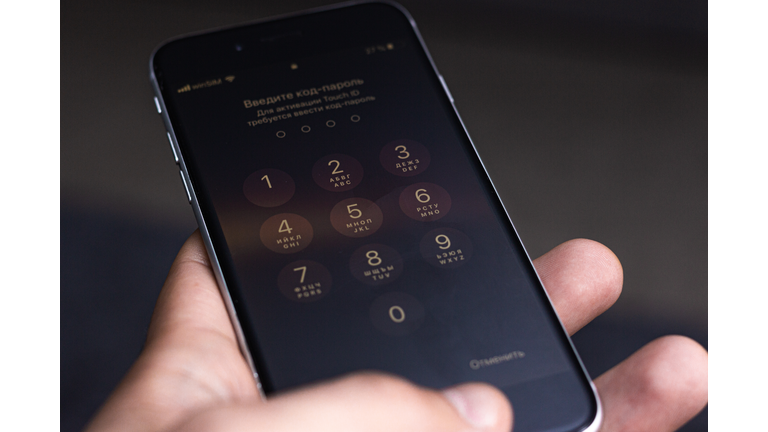 Entering a pin or secret code on a smartphone. The screen with the numbers of a modern smartphone.