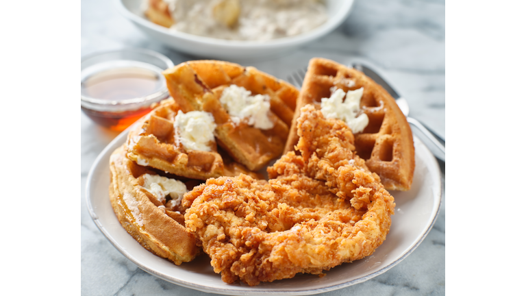 fried chicken and waffles breakfast with syrup