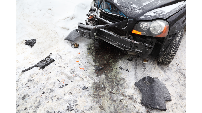 Broken car on road in winter; crash accident