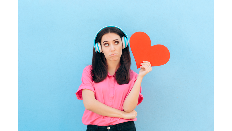 Woman with Headphone Listening to Love Song