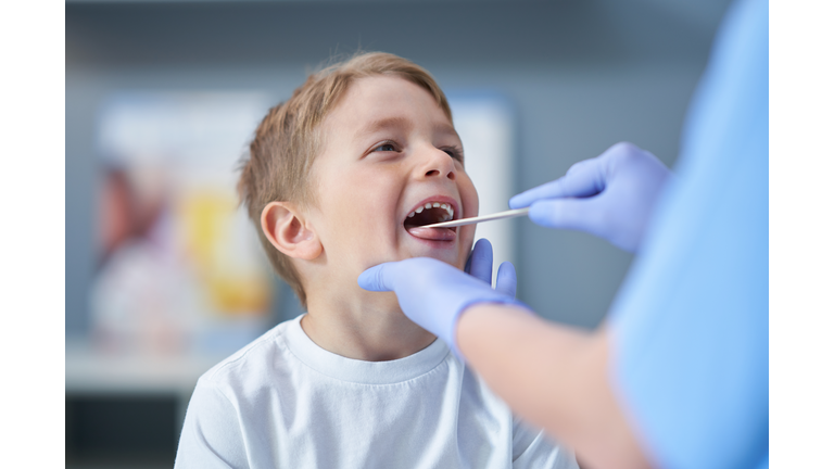 Portrait of adorable little boy having doctor's appointment