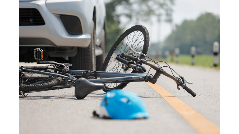 Accident car crash with bicycle on road