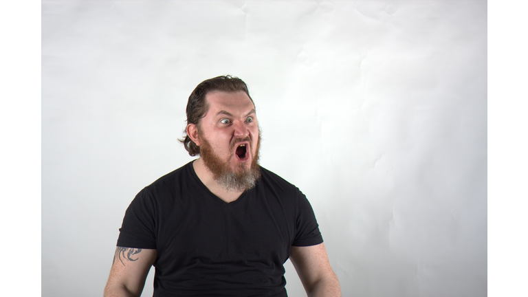 Angry Bearded Man Screaming Against White Background