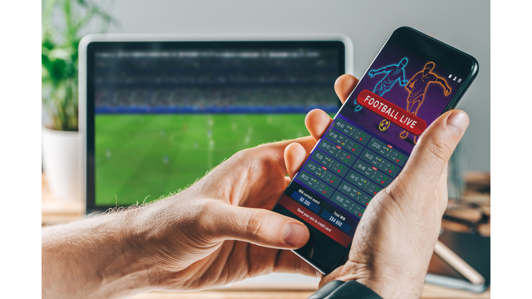 Man celebrating victory after making bets at bookmaker website