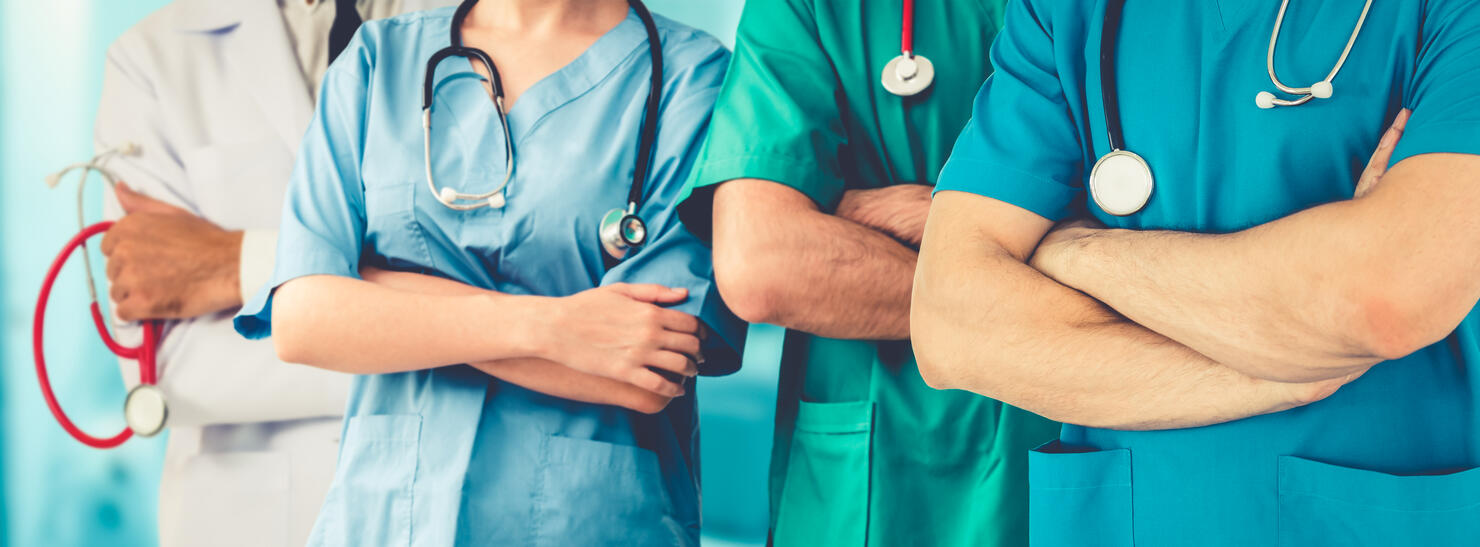 Doctor working in hospital to fight 2019 coronavirus disease or COVID-19. Professional healthcare people with other doctors, nurse and surgeon. Corona virus medical care and protection concept.