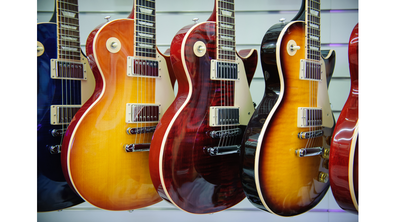 Electric guitars hanging in store