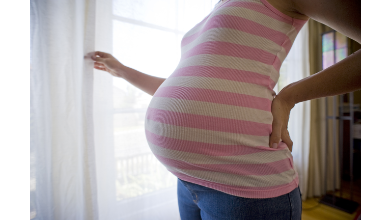 close-up, very pregnant woman's belly