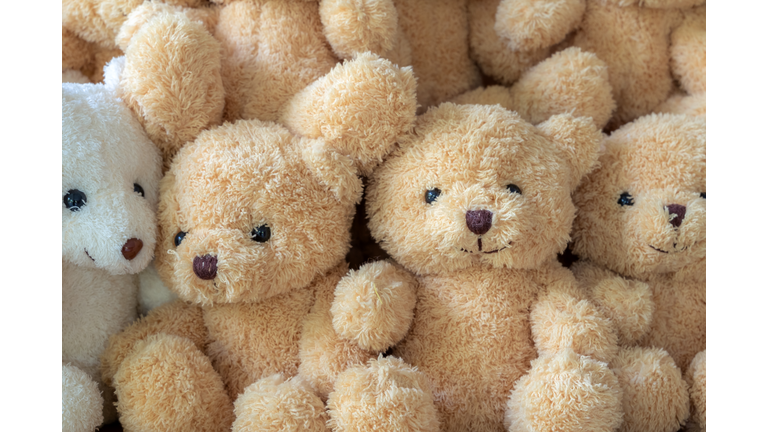 The texture of the teddy bear that is stacked together