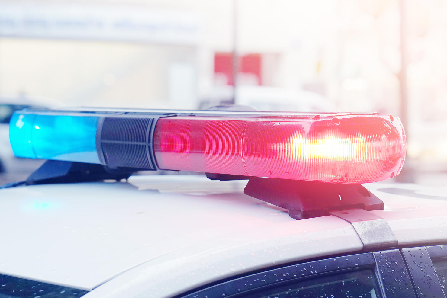 Blue and red lights on top of police car