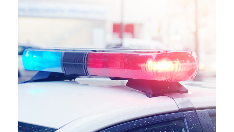 Blue and red lights on top of police car