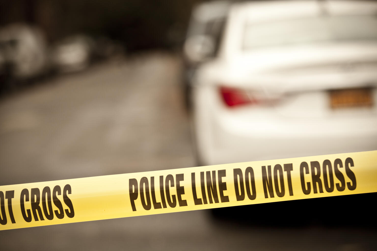 A scene of a crime taped with a do not cross line 