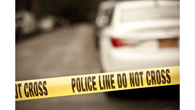 A scene of a crime taped with a do not cross line 