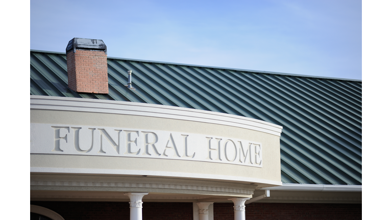 Funeral home sign on building