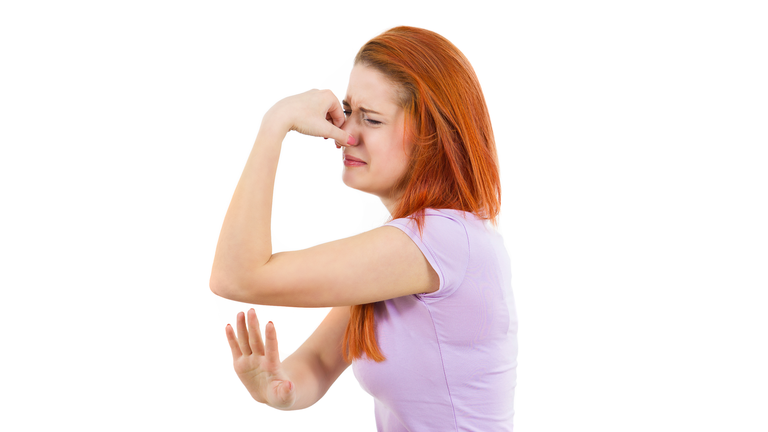 side view profile, headshot portrait young woman, disgust on face, pinches nose, something stinks