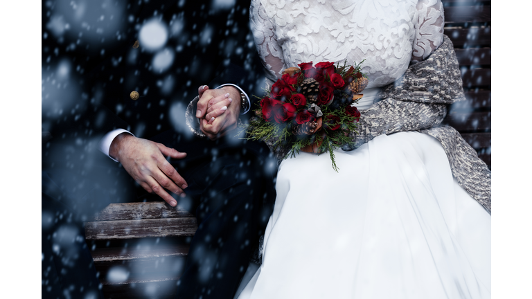 Happy bride and groom enjoying romantic moments outdoors. Wedding couple.Winter concept.