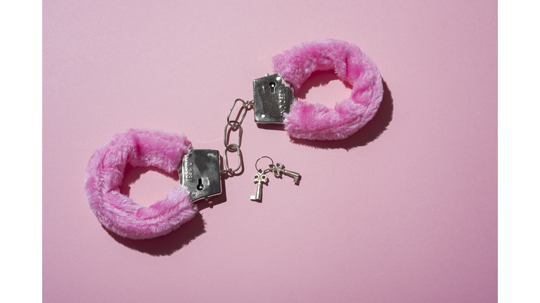 Pink locked handcuffs for adult games