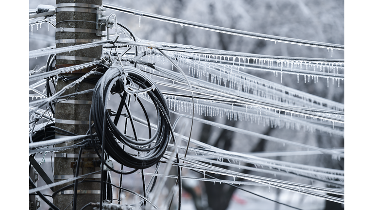 Electricity cables covered in ice after frozen rain phenomenon