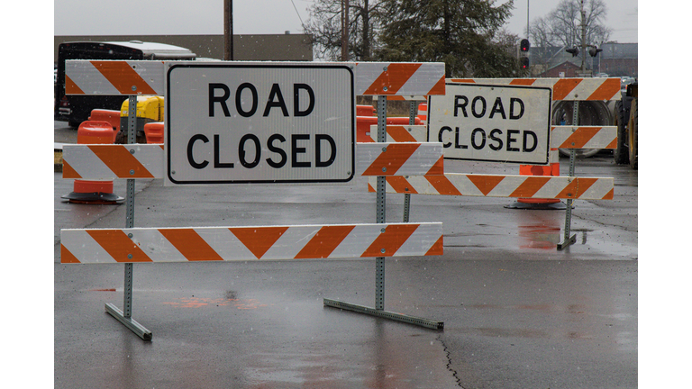 Road Closed Signs as Snow Falls