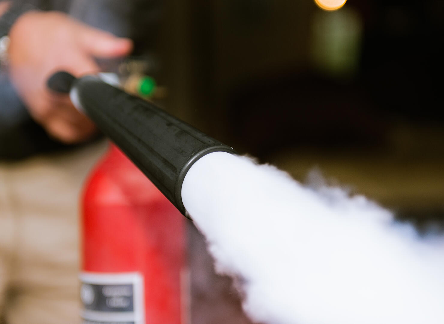 Fire extinguisher being used indoors
