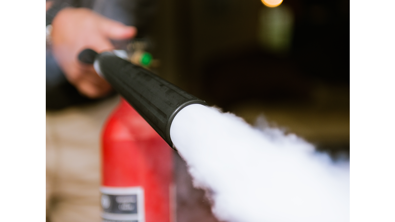 Fire extinguisher being used indoors