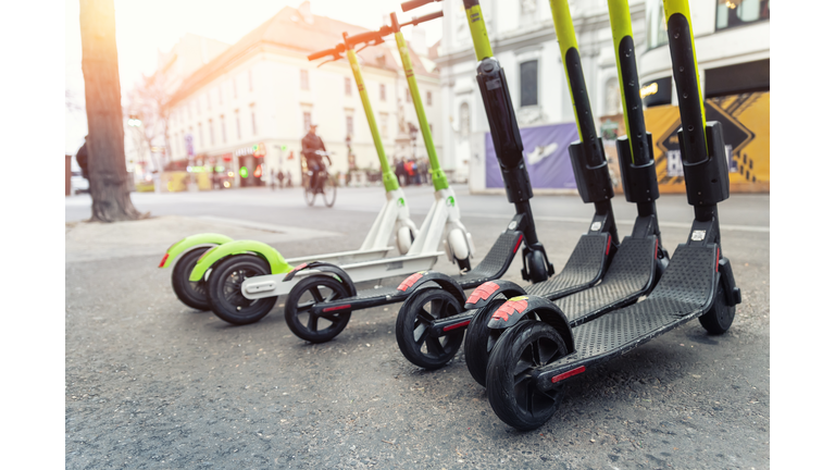 Close-Up Of Push Scooters On Road