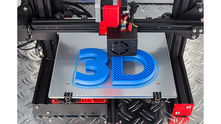 Red black 3D printer printing blue logo symbol on metal diamond plate future technology modern concept