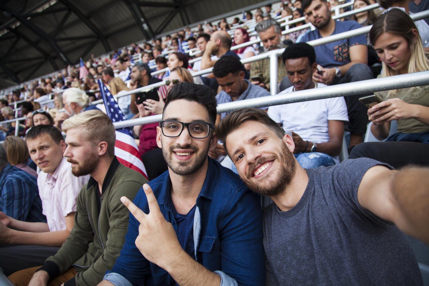 Spectators sitting in stadium