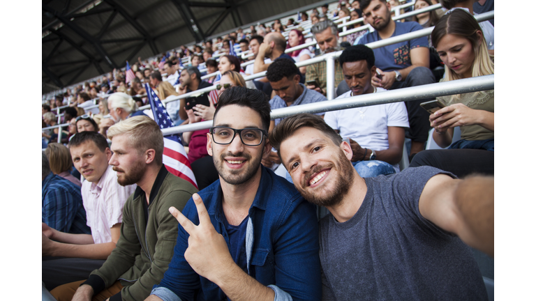 Spectators sitting in stadium