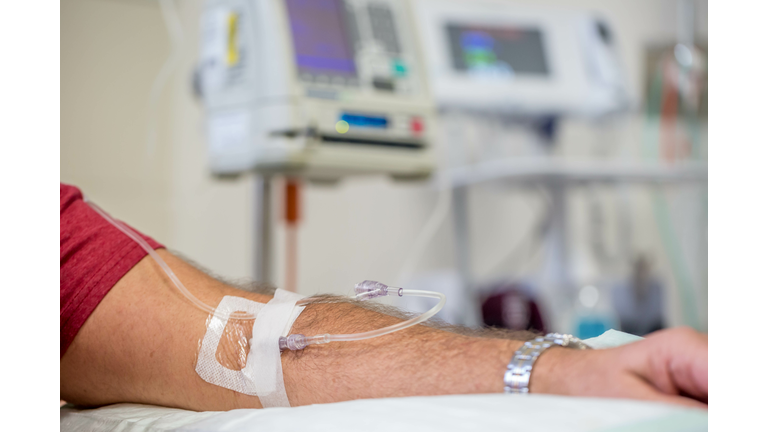 close up view of a mans arm while having an IV immunoglobulin infusion at hospital