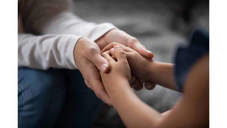 Sincere different generations family sharing secrets or making peace.