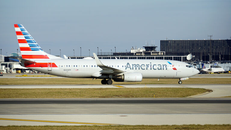 American Airlines Boeing 737 Taxies on the Runway At O'Hare Airport