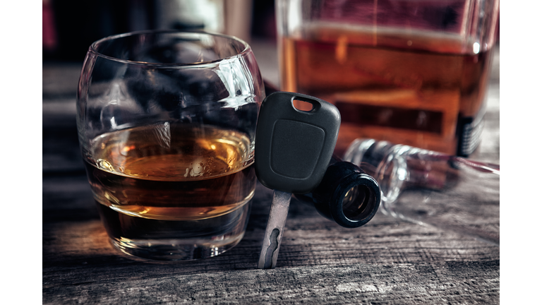 Whiskey in glass and car keys