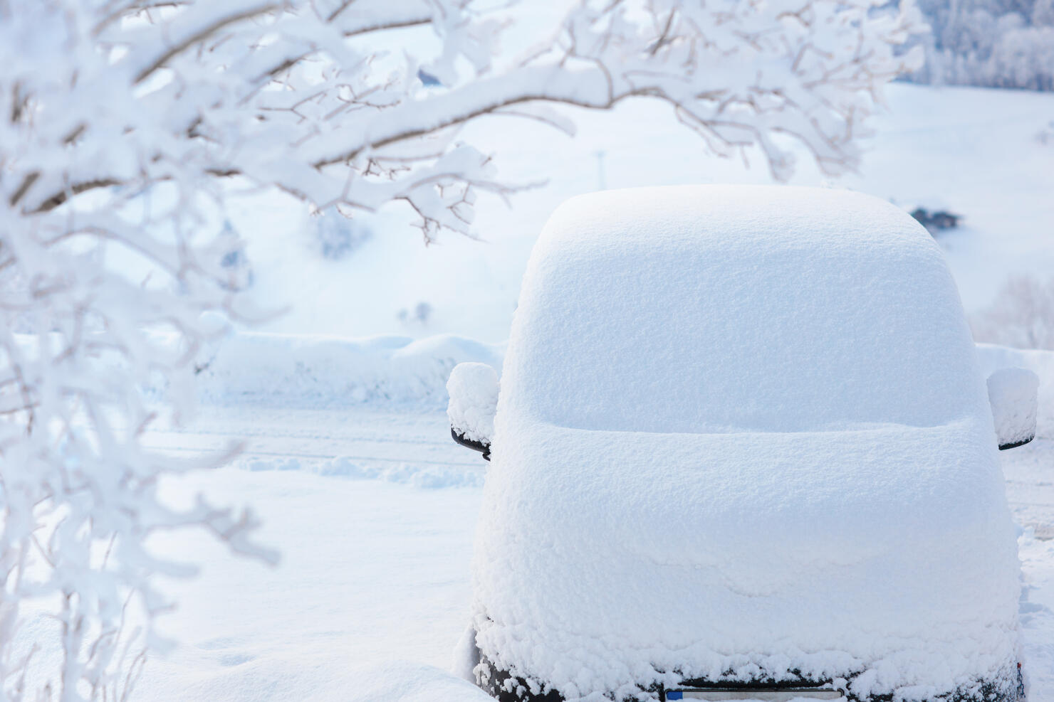 Car covered with snow after winter storm.