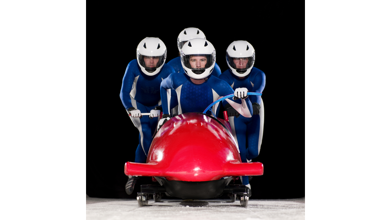 Four man team launching bob-sleigh