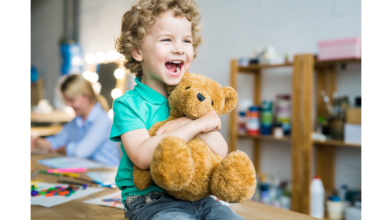 Cute Little Kid Hugging Teddy Bear