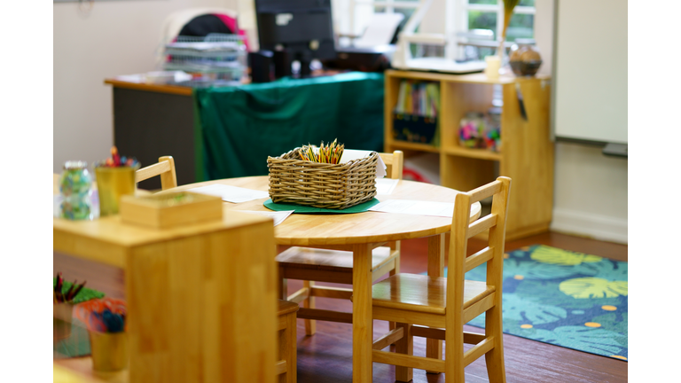 kindergarten education class room insde view include chairs and table