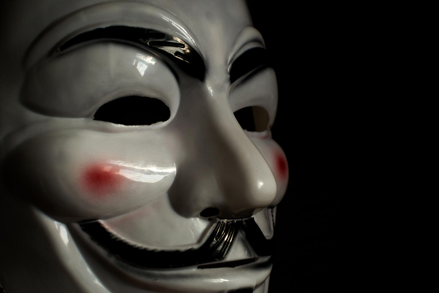Guy Fawkes Mask on a Wooden Background