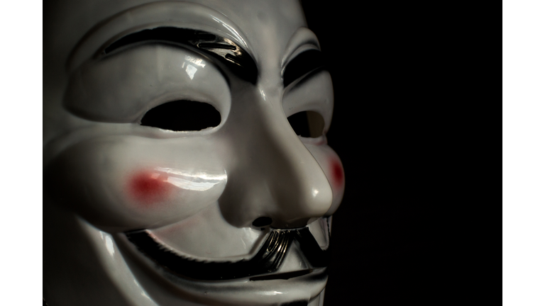 Guy Fawkes Mask on a Wooden Background
