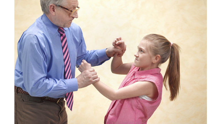 Pupil fighting with teacher