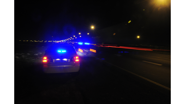 Police cars with blue flashing lights 